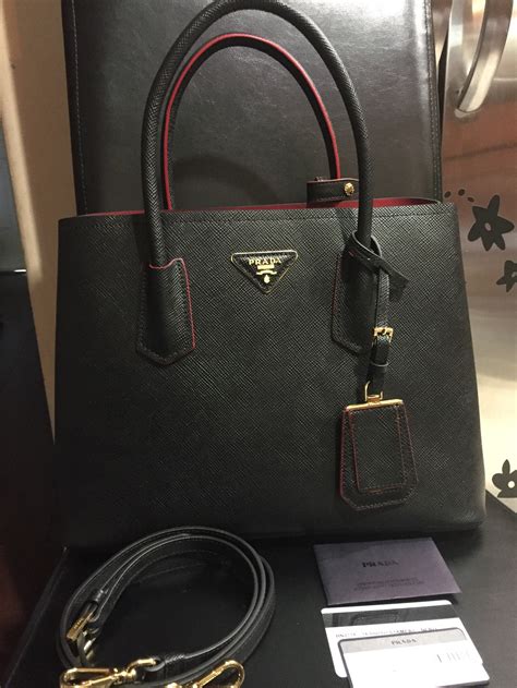 prada saffiano bag black red|More.